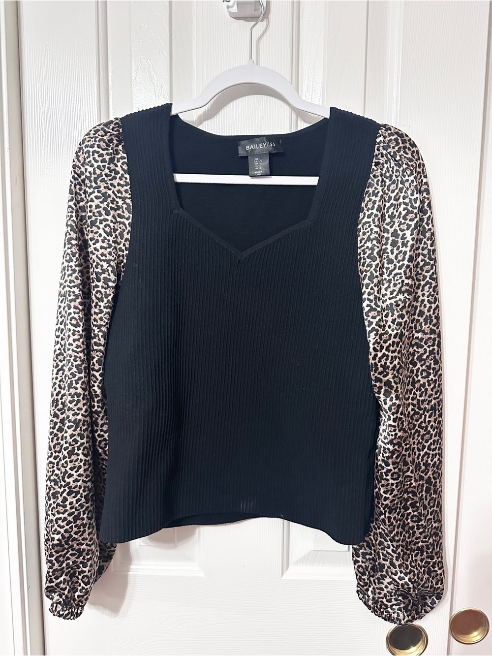 Bailey 44 Black Ribbed Sweater with Leopard Print Puff Sleeves